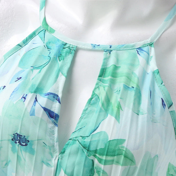 Chic women's summer maxi dress with a beautiful floral print, flattering halter neckline, and a distinctive twist waist.