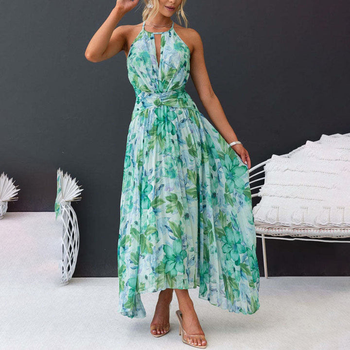 Stylish women's floral halter neck pleated maxi dress with a unique twist waist, perfect for elegant summer fashion.