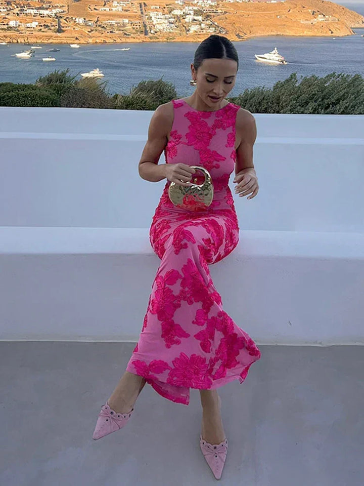 Flowing floral maxi wedding guest dress with high neck. A beautiful, elegant choice for special occasions.