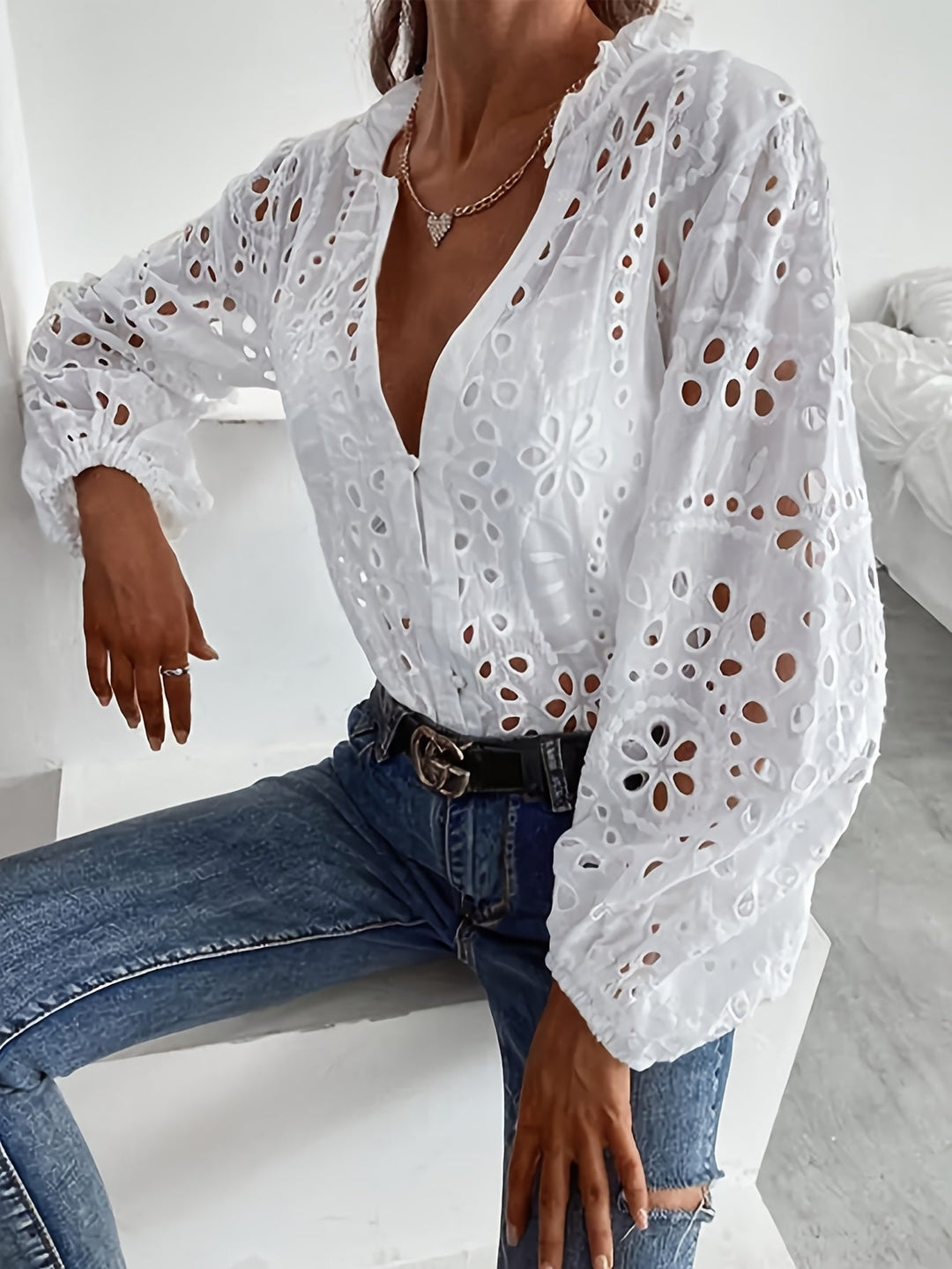 Beautiful floral pattern on an elegant women's long-sleeve button-front blouse. Versatile top for office or daily wear.