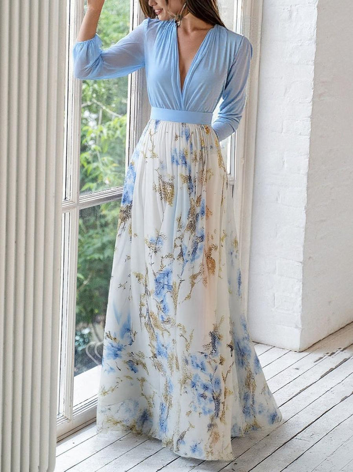Comfortable women's flowing maxi dress featuring a beautiful floral print and elegant V-neck design for summer.