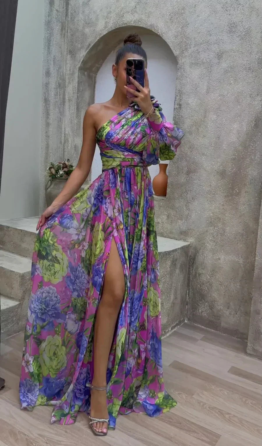 Elegant women's floral maxi dress with a sophisticated slit, perfect for spring occasion wear.