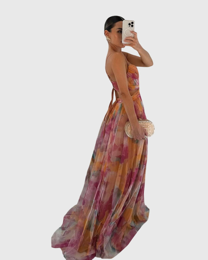 Patterned floral maxi dress with elegant design and crisscross back, a stylish summer women's dress.