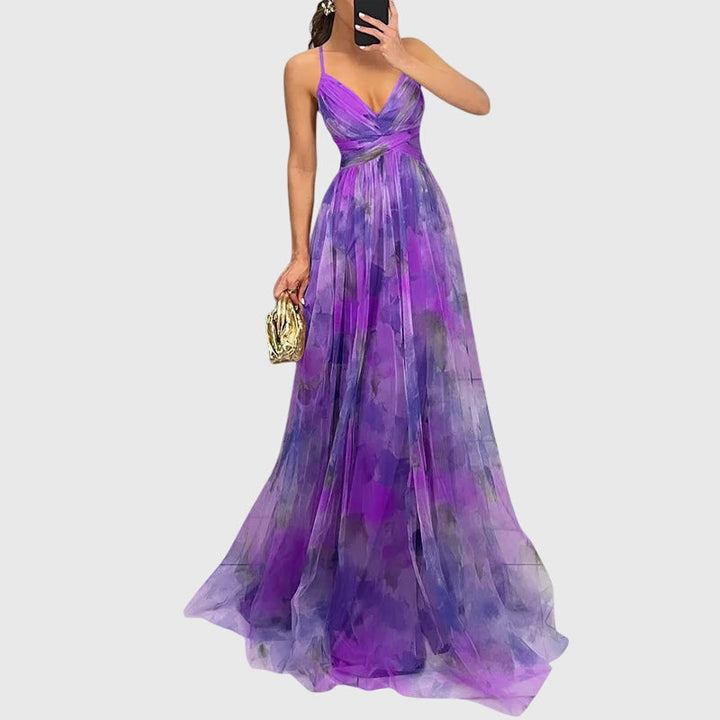 Beautiful women's floral maxi dress with crisscross straps, elegant and flowy for summer.