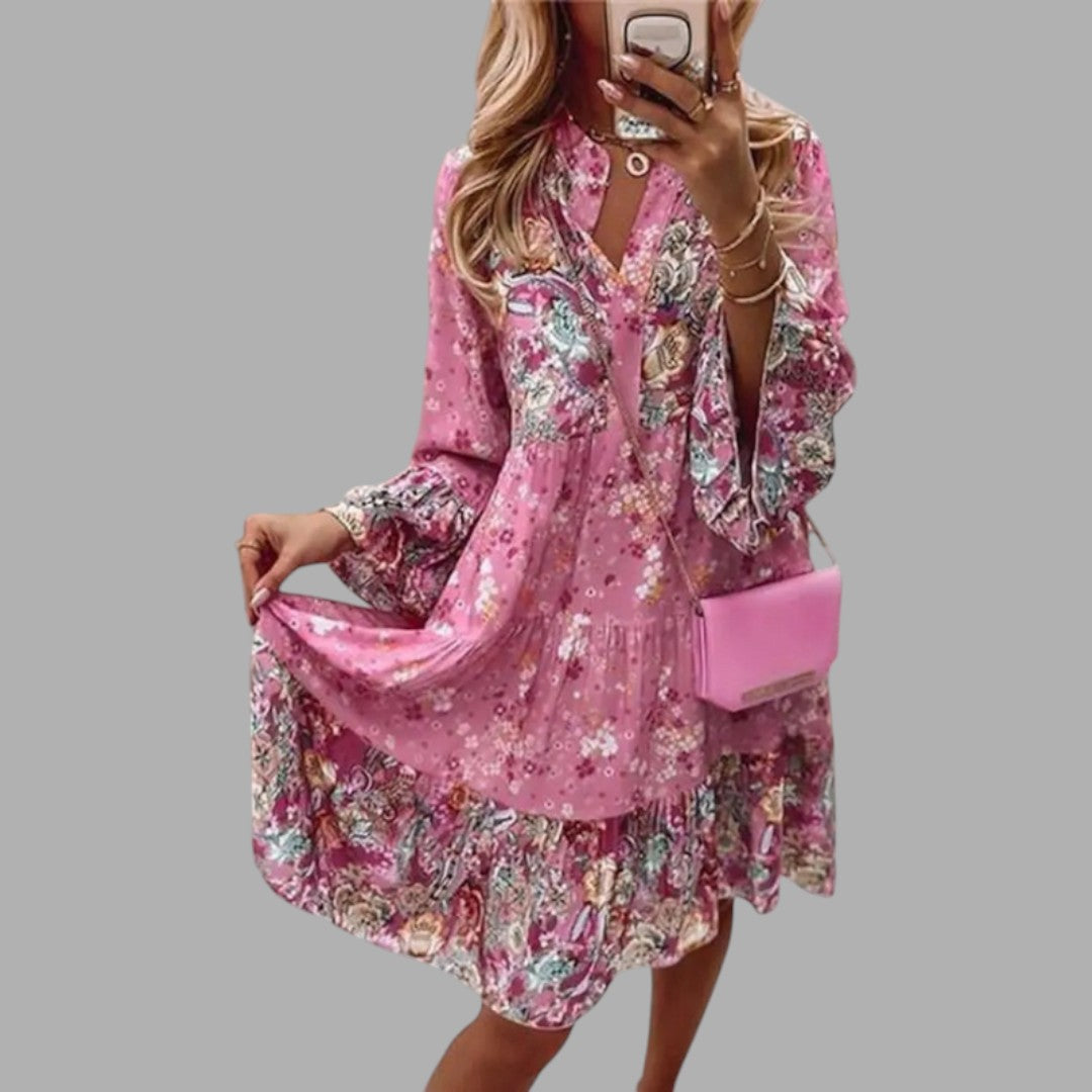 Elegant women's floral midi dress for semi-formal occasions, featuring a beautiful print and comfortable fit.