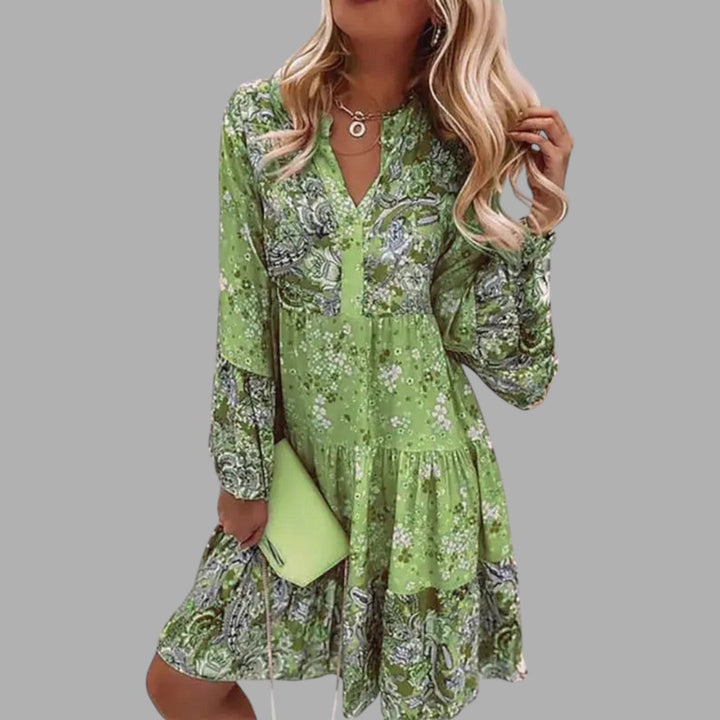 Stylish women's midi dress with a vibrant floral print, ideal for a comfortable and elegant semi-formal look.