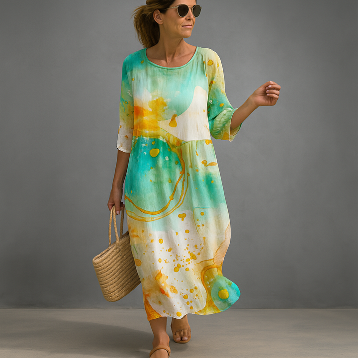 Stylish women's summer floral midi dress. Ideal elegant party or occasion dress in a comfortable blue and green pattern.