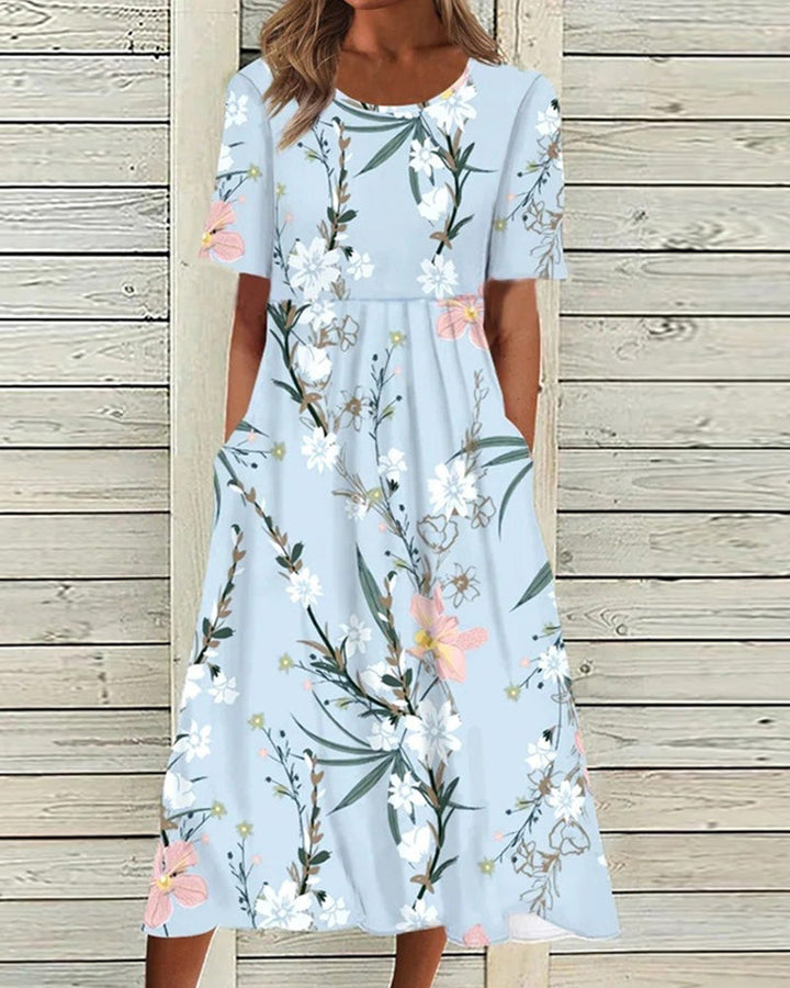 Elegant women's floral midi dress with short sleeves, round neck, and practical pockets, perfect for summer casual wear.