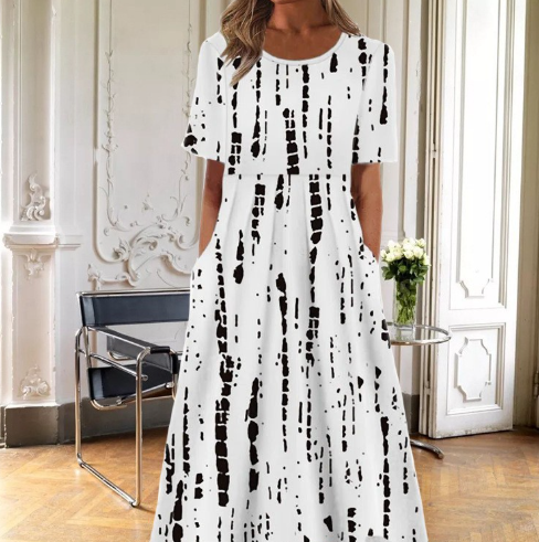 Comfortable women's flared floral midi dress. Features short sleeves & a round neck, ideal for day wear.