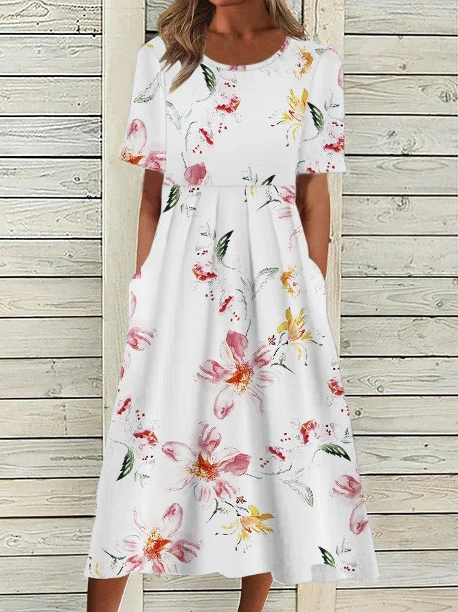 Stylish women's floral midi dress for effortless spring/summer wear. Features short sleeves, round neck, and a flattering design.