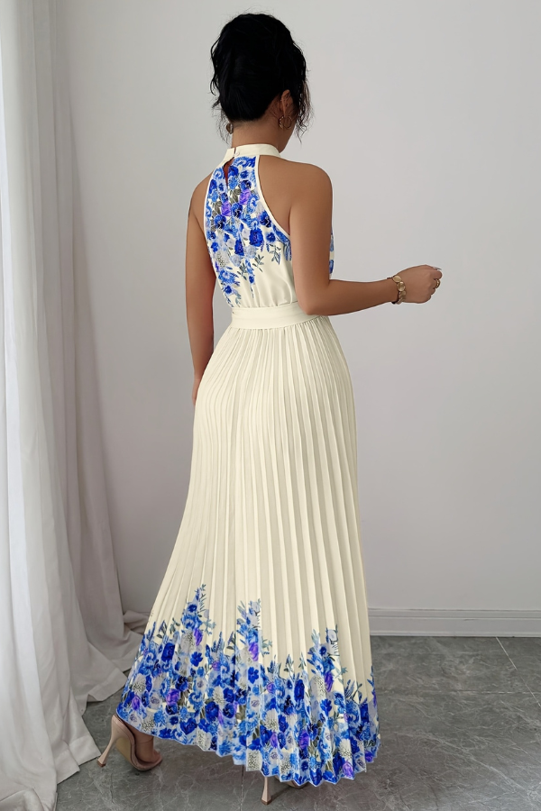 Feminine women's floral midi dress, elegantly pleated with a trendy square neck, a versatile wardrobe essential.