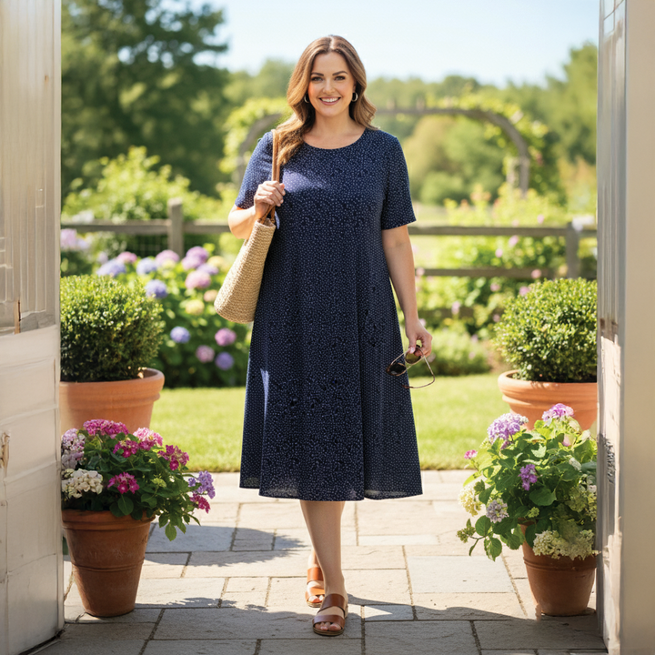 Elegant women's floral print short summer midi dress. Breezy sleeveless design, perfect for beach, vacation, or casual wear.