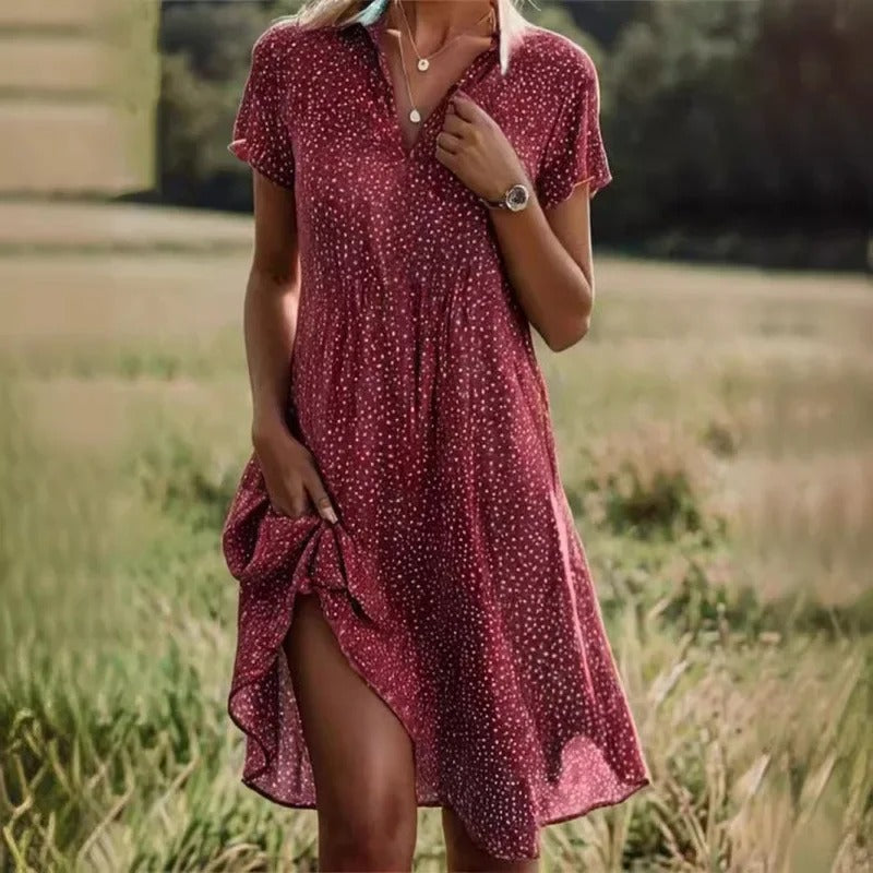 Women's elegant floral print short summer midi dress. Sleeveless, breezy, ideal for vacation, beach, or party outfits.