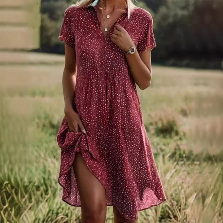 Women's elegant floral print short summer midi dress. Sleeveless, breezy, ideal for vacation, beach, or party outfits.