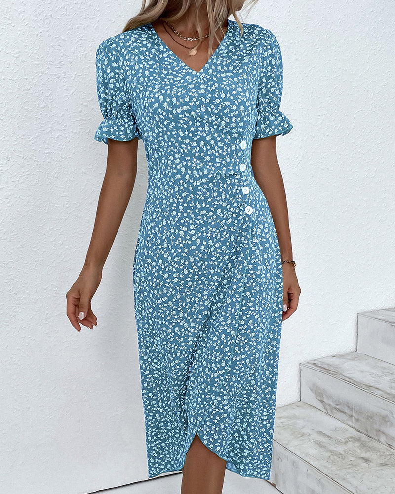 Comfortable fabric texture on an elegant women's floral V-neck flowy summer midi dress. Quality feel.