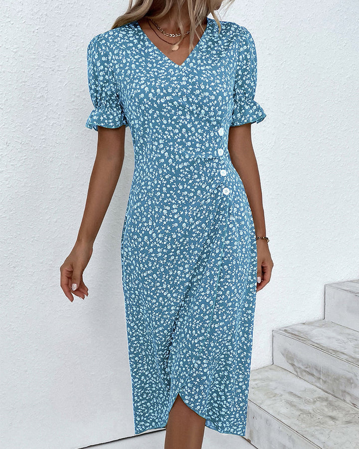 Comfortable fabric texture on an elegant women's floral V-neck flowy summer midi dress. Quality feel.