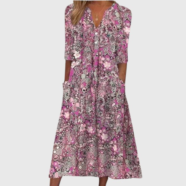 Stylish women's summer floral V-neck midi dress with half sleeves. Elegant printed A-line day dress for spring fashion.