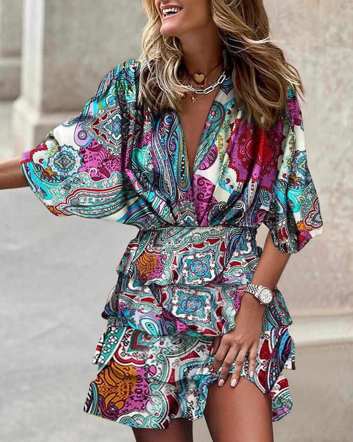 Versatile women's floral print wrap dress, featuring tiered ruffles & long sleeves. Suitable for casual or elegant wear.