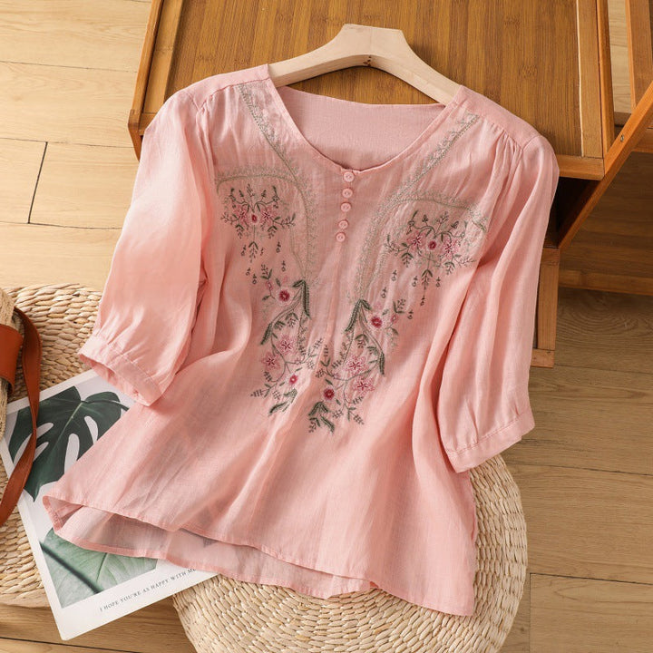 Women's long sleeve embroidered floral relaxed fit blouse. Versatile top for elegant spring & summer fashion.