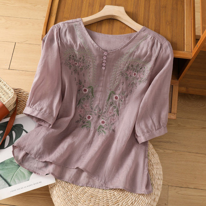 Relaxed fit women's floral V-neck blouse for casual wear. Comfortable and stylish for spring & summer.