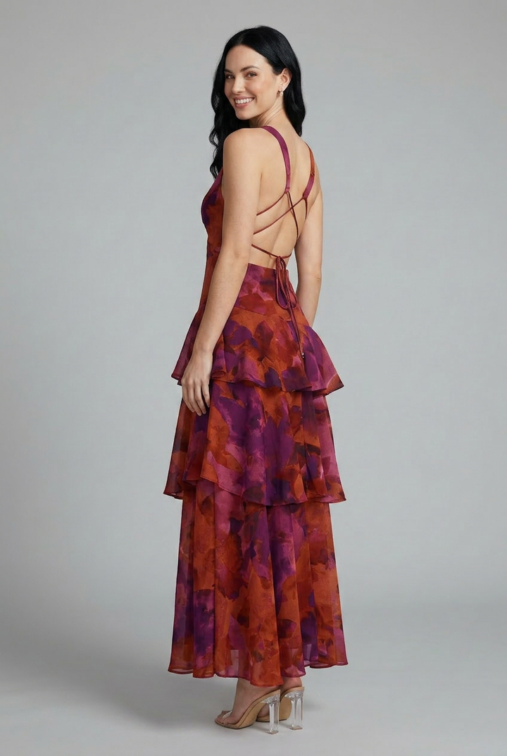 Flowy women's sleeveless maxi dress, featuring a stylish V-neckline and beautiful tiered floral pattern.