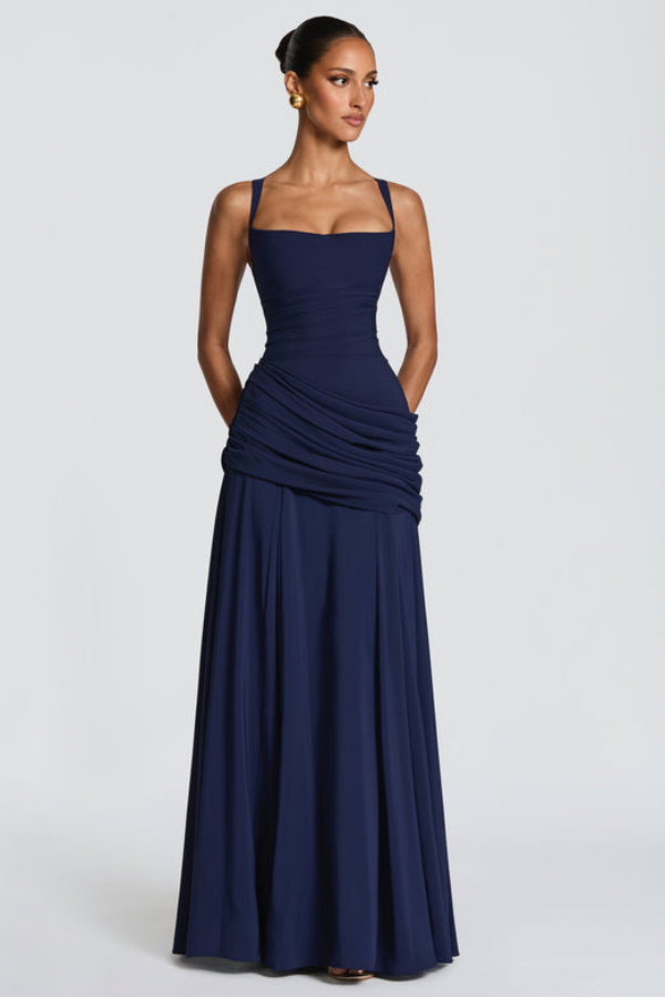 Vibrant yellow women's flowing maxi dress, perfect for summer outings or any special occasion, flattering style.