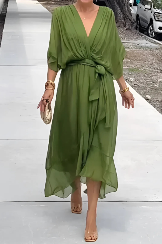 Close-up of the elegant flowing fabric of a women's maxi dress. Perfect for summer or evening events.