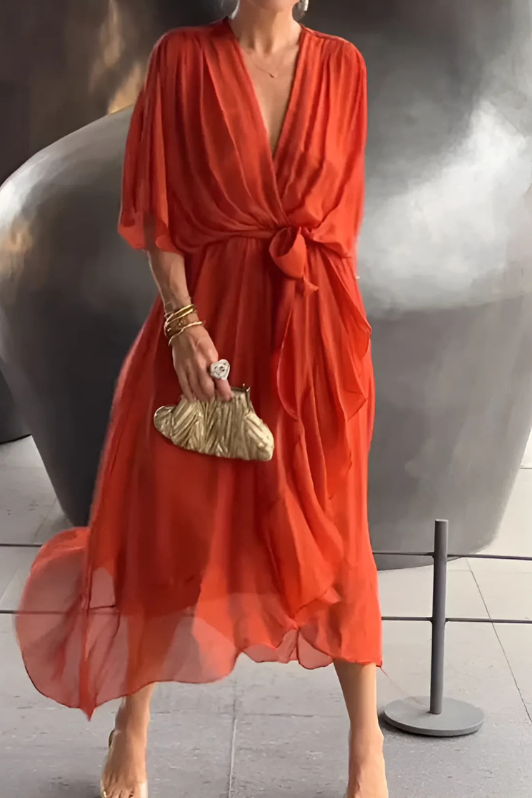Comfortable women's elegant flowing maxi dress with a modest design, ideal for evening wear or chic summer parties.
