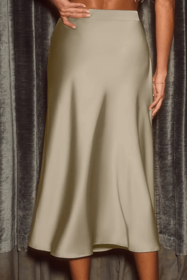 Fashionable women's elegant midi skirt, A-line flowy style. Sophisticated and versatile for any look.