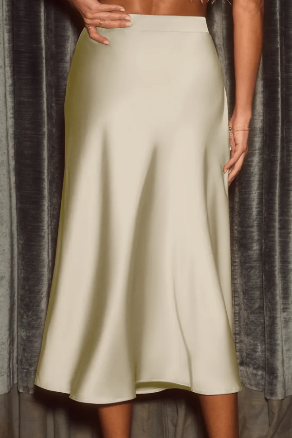 Modern elegant women's midi skirt, high-rise A-line flowy design. Versatile for contemporary fashion.