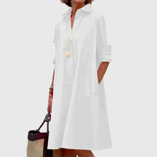 Beautiful women's flowy dress with pockets, offering comfortable and elegant casual wear for spring.