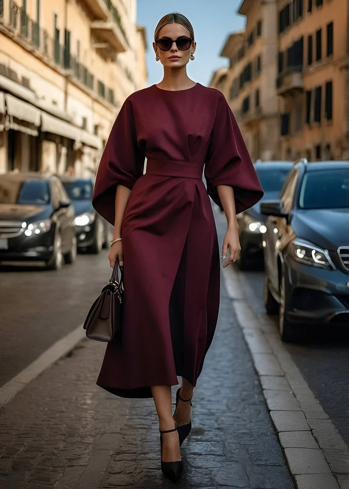 Elegant women's flowy maxi dress with a chic waist belt, perfect for summer parties or sophisticated events.