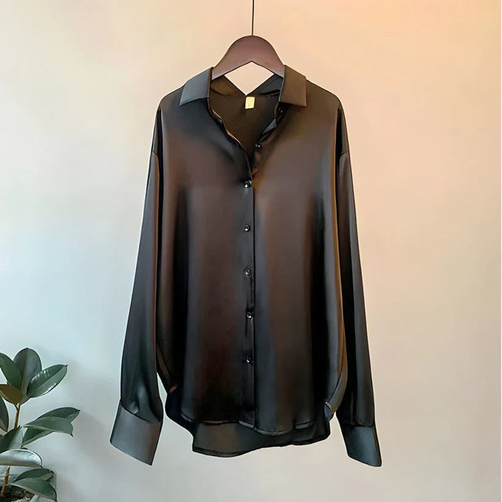 Versatile women's long sleeve button down blouse, an elegant oversized top for both workwear and casual outfits.