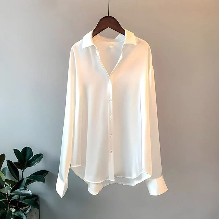 Flowy women's oversized button down blouse, luxurious and long-sleeved, ideal for elegant work or casual wear.
