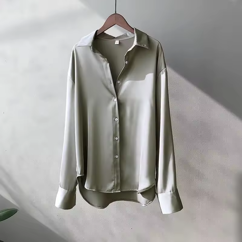 Luxurious flowy women's oversized button down blouse, a stylish long sleeve top with an elegant relaxed fit.