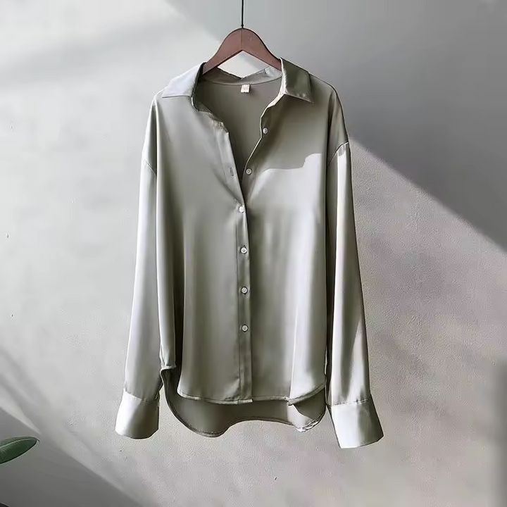 Luxurious flowy women's oversized button down blouse, a stylish long sleeve top with an elegant relaxed fit.