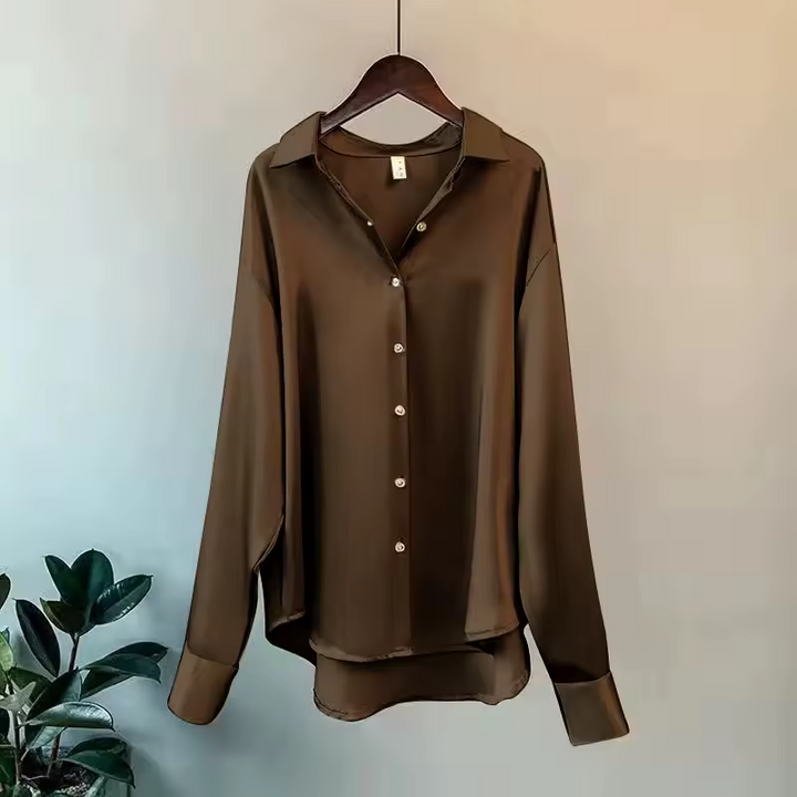 Women's elegant button down blouse, oversized and flowy, a versatile long sleeve top for workwear and casual chic.