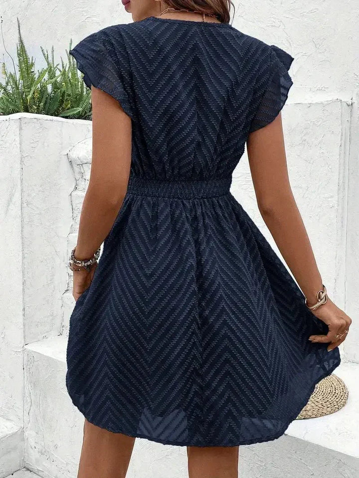 V-neck flutter sleeve women's mini dress, an elegant & chic short dress for any occasion.