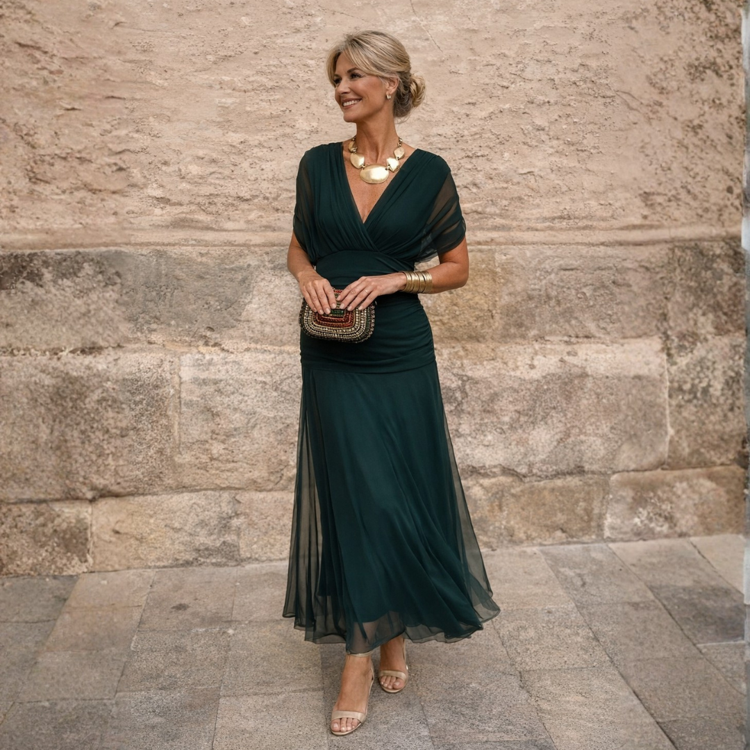 Elegant women's gathered V-neck midi dress with flutter sleeves, perfect for special occasions & evening events.