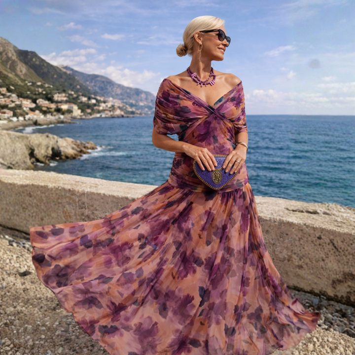 Model wears stylish women's V-neck midi dress with flutter sleeves, ideal for wedding guests & formal occasions.