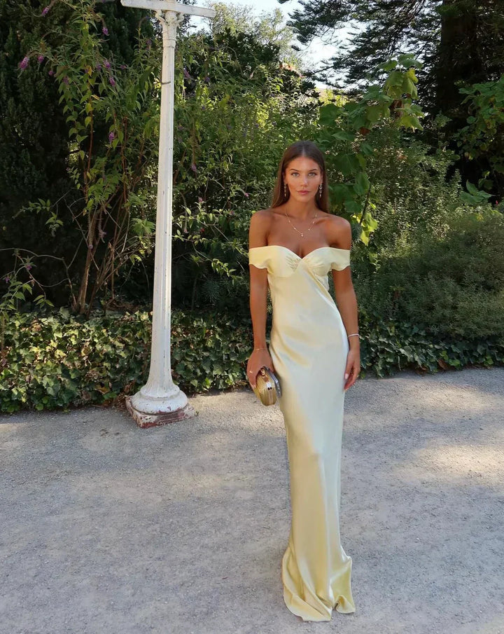 Chic women's off-shoulder gold maxi dress, ideal evening wear or formal gown for wedding guests & parties.