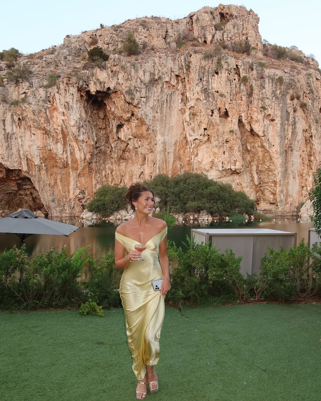 Sophisticated women's gold off-shoulder maxi dress, a chic long evening wear option for formal events & parties.
