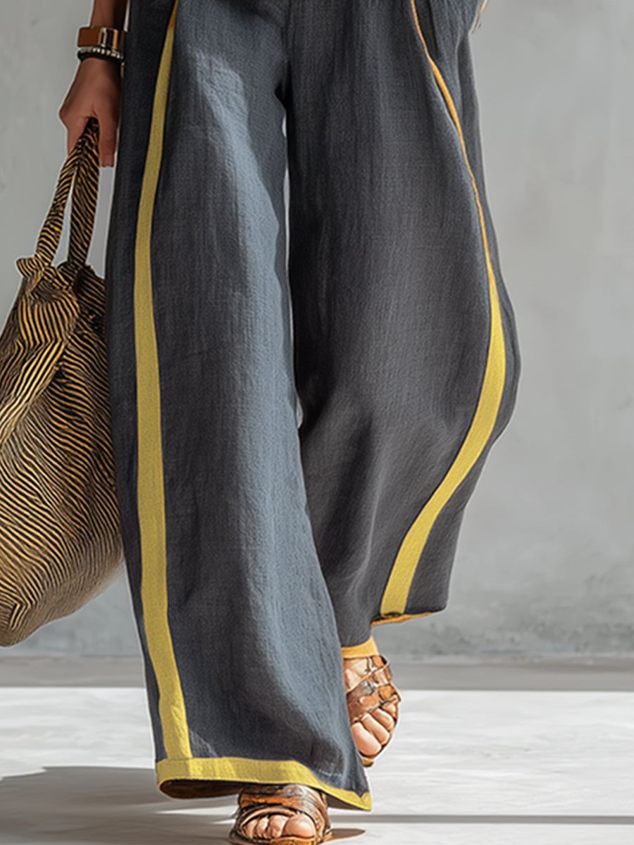 Stylish women's gray two-piece vest & pants co-ord. Elegant matching set perfect for modern versatile fashion.