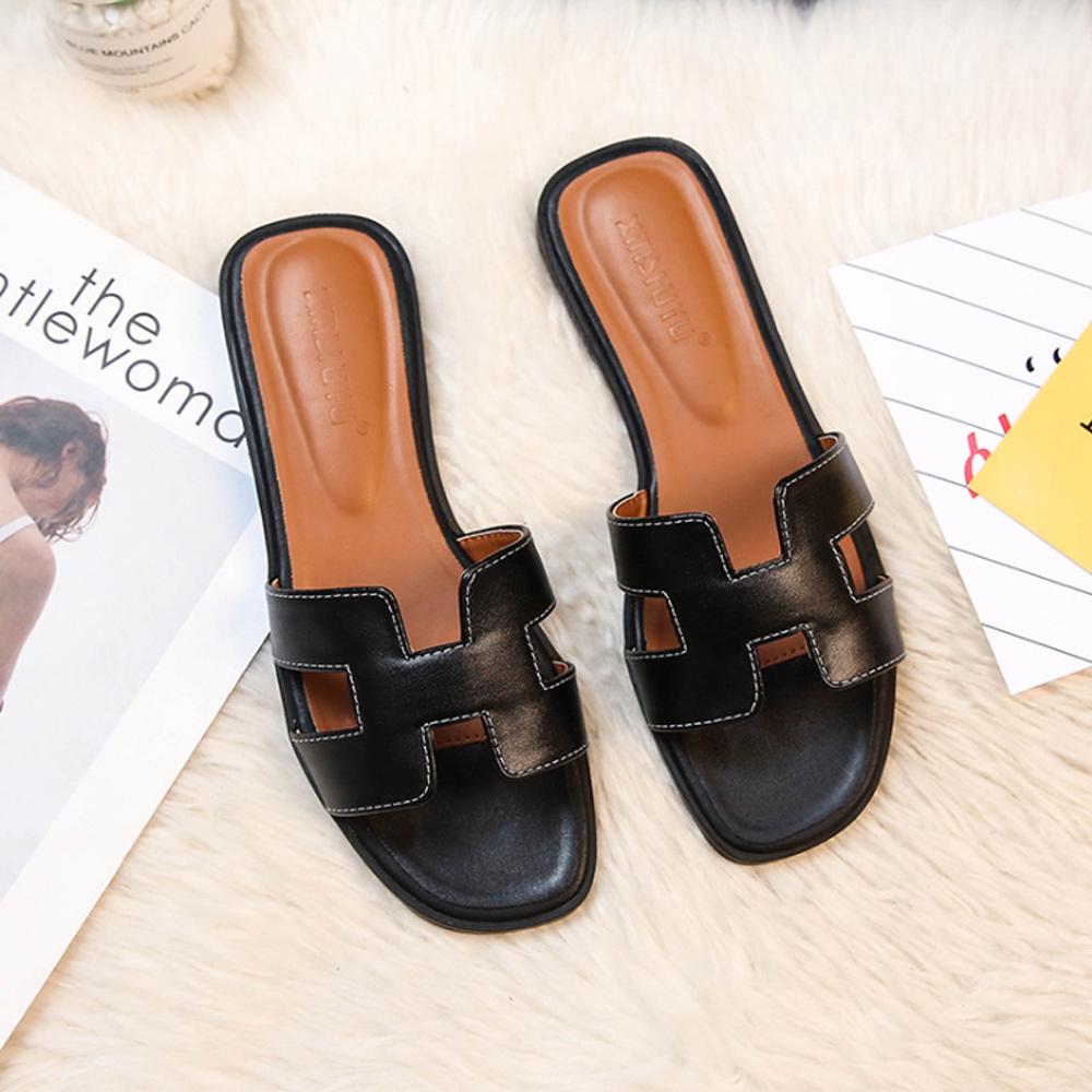 Versatile women's slip-on sandals with stylish H-straps & low heel. Ideal for casual or dressy outfits.