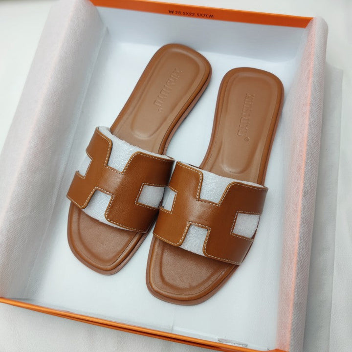 Comfortable women's H-strap sandals, easy slip-on style with a subtle low heel for all-day wear.