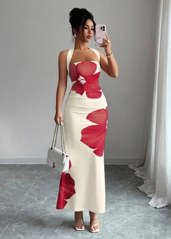 Chic women's long floral print maxi dress with a stylish halter neckline, embodying elegant summer style.