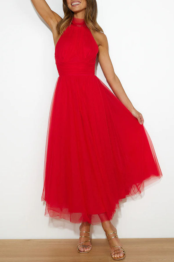 Women's elegant halter maxi dress, a perfect wedding guest gown for formal evening wear.