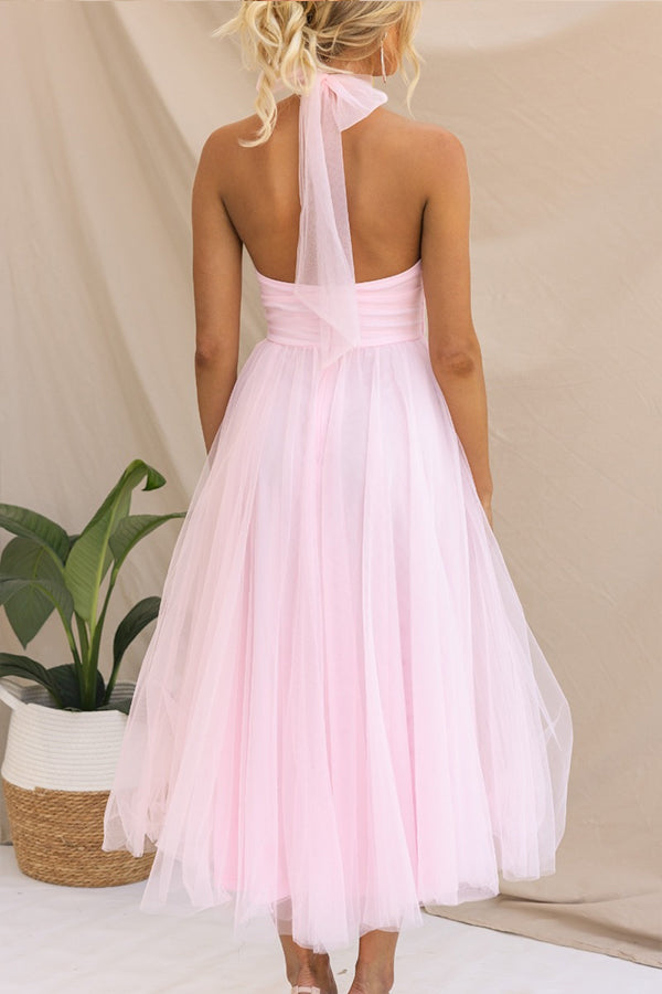 Flowing women's long halter maxi dress, elegant and formal, ideal as a wedding guest or evening gown.