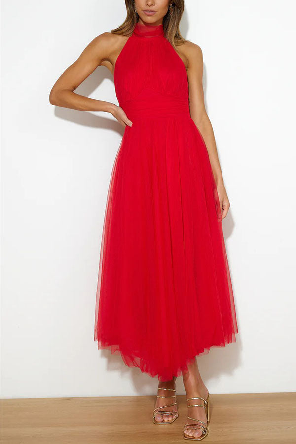 Flowy halter neck maxi dress for women, ideal elegant wedding guest or special occasion attire.