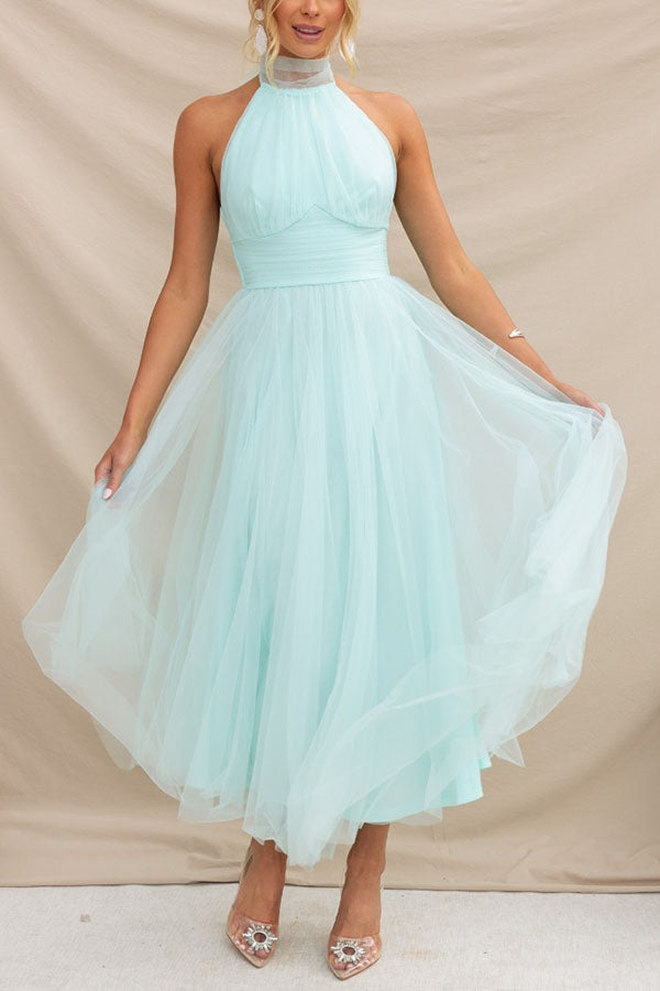Women's elegant halter neck maxi dress, a beautiful formal gown for wedding guests & evening events.